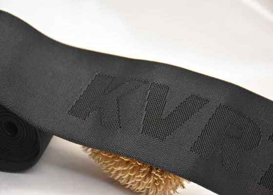 Изготовленная на заказ заклеймленная эластичная резиновая лента жаккарда логотипа 52mm с двойным, который встали на сторону материалом